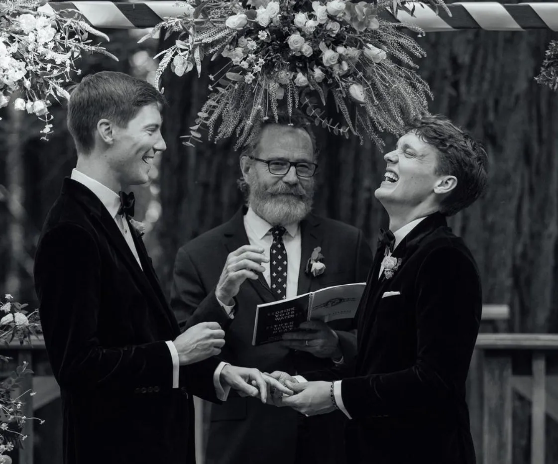 Fielder Jewett and his husband Hunter Doohan exchanging wedding rings.