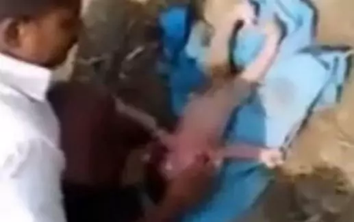 This is the moment a newborn baby girl was rescued - after being buried alive. As soon as she surfaced the baby started crying, stunning a crowd of spectators