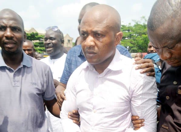 Evans flanked by security operatives