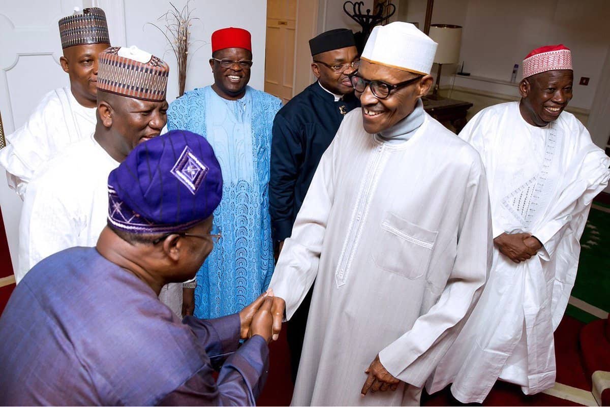 Buhari exchanging pleasantries with Ajimobi