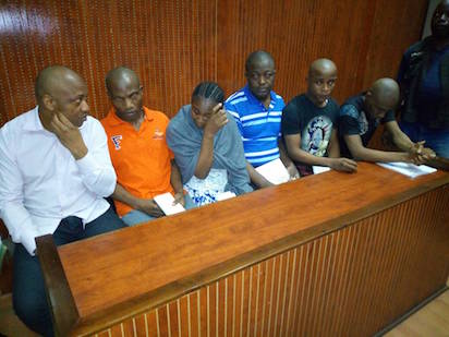 Evans with his fellow kidnappers during a court hearing
