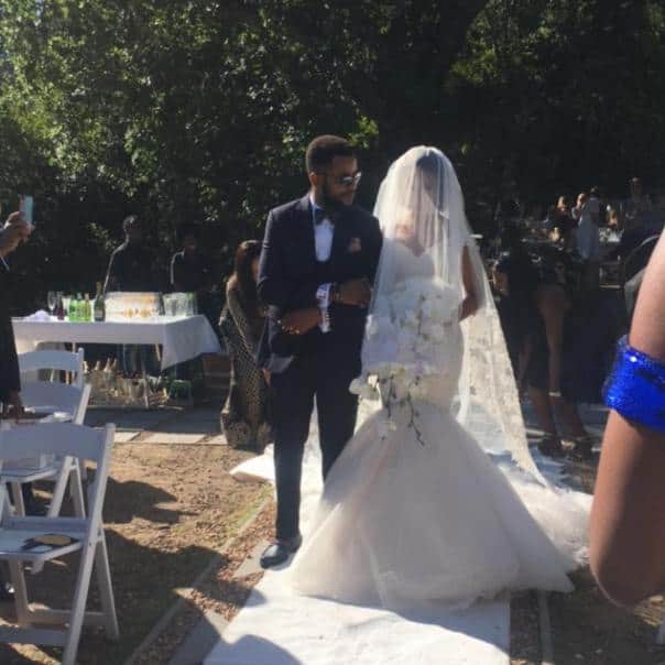 The bride, Adesua Etomi being led down the aisle