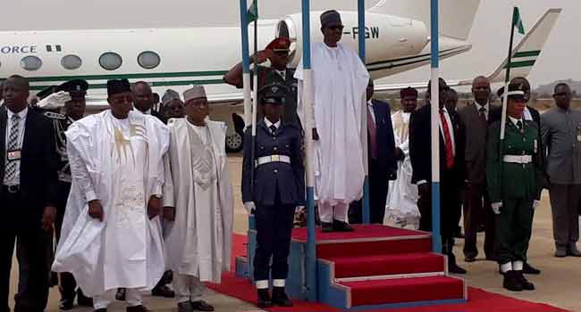  Buhari inspecting a Guard of Honour mounted by the military.