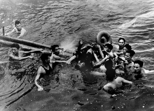 A photo taken 26 October 1967 shows US Navy Airforce Major John McCain (C) being rescued from Hanoi's Truc Bach lake by several Hanoi residents after his Navy warplane was downed by Northern Vietnamese army during the Vietnam War. One of his rescuers said 24 February 2000, McCain was well treated after being pulled from the lake by villagers. McCain said that upon capture he was beaten by an angry mob and bayoneted in the groin. (B/W ONLY) Nigeria News PHOTO / Nigeria News PHOTO / VNA