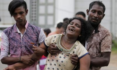 Relatives of a blast victim grieve outside a morgue in Colombo, Sri Lanka