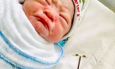 Newborn Baby Holds Contraceptive Coil The Mother Used To Avoid Pregnancy (Photos)