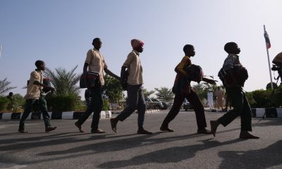 Freed students were led into a government building in Katsina, Nigeria, on Dec. 18.