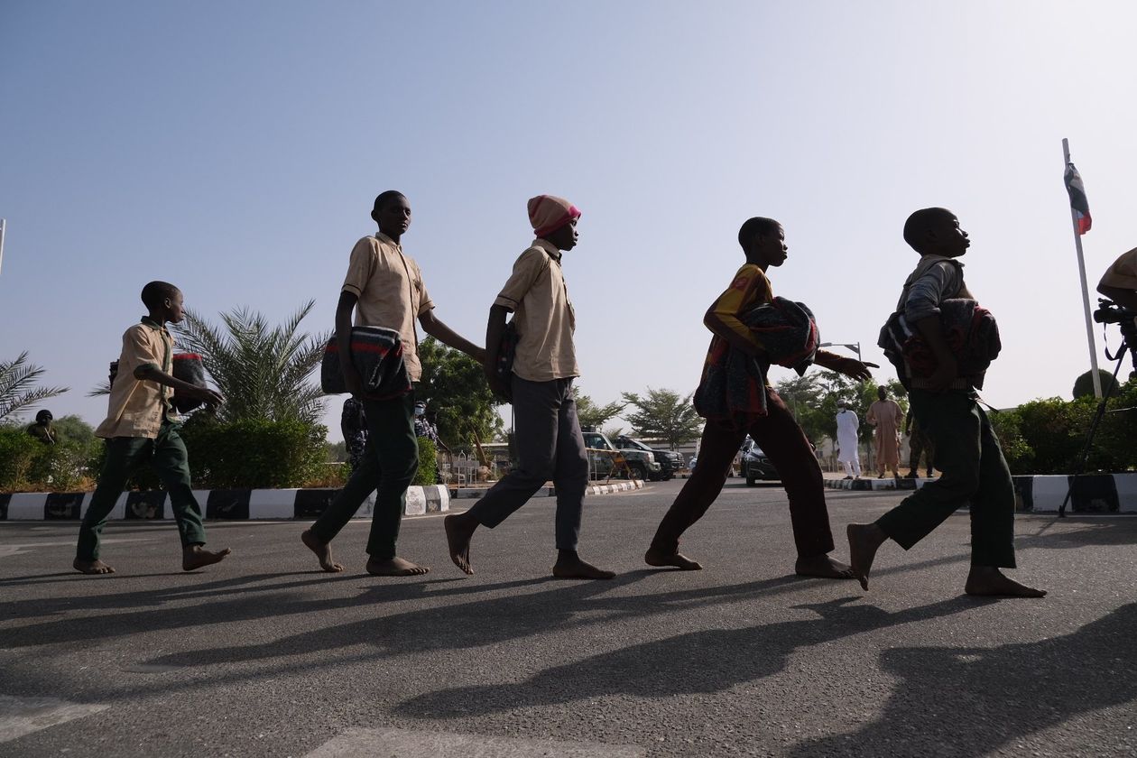 Freed students were led into a government building in Katsina, Nigeria, on Dec. 18.