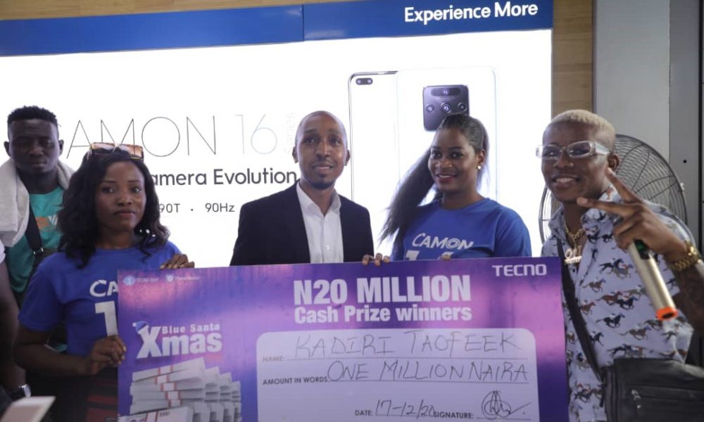  One of the winners being presented with a cheque of 1Million Naira by Small Doctor