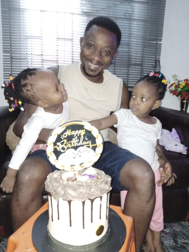 Nigerian Man Reacts After Wife Surprises Him With His First Birthday Cake |Photos