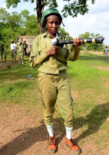 Mixed Reactions As Beautiful Corper Poses With A Gun Hours After NYSC DG Remarks