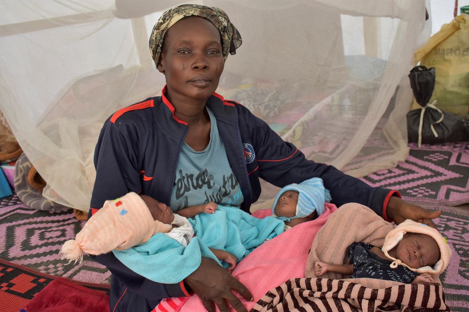 Heavily pregnant Fatime Eliane journeyed for three days by foot and dugout canoe last month to flee violence in northern Cameroon between herders, farmers and fishermen. Upon arriving in neighbouring Chad, an equally daunting test awaited her. Three weeks later, the 32-year-old mother of seven gave birth to triplets in a hospital in the capital N'Djamena. "Even when I was pregnant in Cameroon, I didn't know I was carrying triplets but physically I was in pain," she said as she breastfed one of the newborns, swaddled in a pink blanket, inside her tent at a refugee camp outside of N'Djamena. Eliane fled her ethnic Mousgoum fishing and farming village last month when it was attacked by Arab Choa herders, who burned down her neighbours' houses, she said. More than 100,000 Cameroonians fled the violence - with dozens killed in tit-for-tit reprisal attacks - that broke out following disputes over dwindling water resources, according to the U.N. refugee agency UNHCR. Eliane's husband and three eldest children stayed in Cameroon, where they sought refuge at a site for internally displaced persons. In Chad, Eliane now has seven young mouths to feed from the limited rations provided to the refugees. "The birth of the triplets is a blessing but I am very worried because we have no food or money," said her mother-in-law, Mariam Abakar, who later joined Eliane at the camp. "Without assistance from the authorities, we will not be able to find food for the mother and her newborns." Eliane, for her part, said she hopes to earn some money selling cakes at the local market of a town not far from the refugee camp.