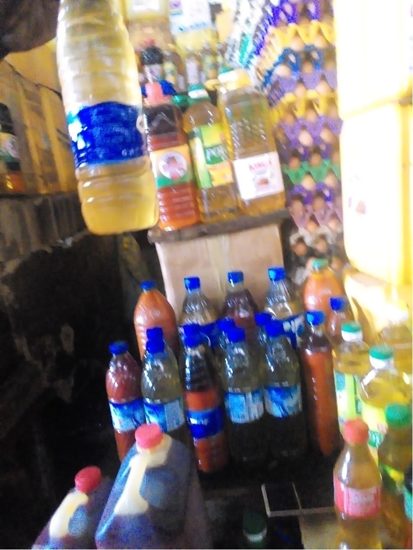 Unbranded oils in plastic bottles displayed on the counter at Wuse Market in Abuja where Usman purchases his ‘mixed’ suya oil. Photo credit: Adesola Ikulajolu
