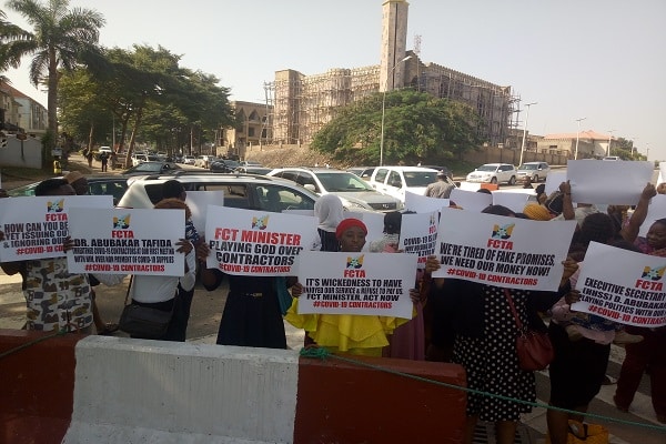 BREAKING: Gridlock As COVID-19 Contractors Protest In Abuja