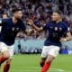 Olivier Giroud (L) and Kylian Mbappe (R) celebrate the former scoring for France against Poland at the World Cup