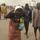 Reactions As Woman Appears At Mowe Protest Drinking Garri From Pot - [Video]