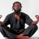 AI generated image of a young African man meditating - Picture created with DALL·E