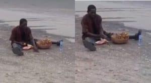 #ElectionResults: Drama As Mad Man Eats Up Food Sacrifice Placed At Lagos Polling Unit (Video)