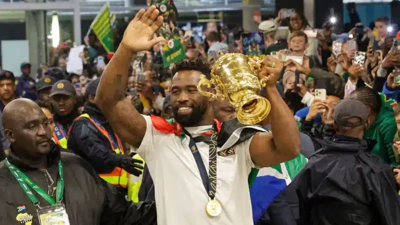 The rugby union team from South Africa has returned home from France following their historic fourth World Cup victory.