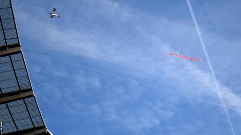 During the Premier League game between Manchester City and Liverpool at the Etihad Stadium, two banners flew over the stadium for separate reasons.