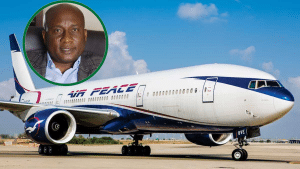 Airpeace aircraft on the tarmac with a picture of the airline CEO, Allen Onyema