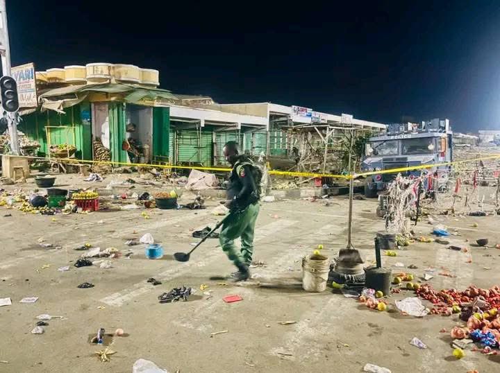 Nigerian Police Explosive Ordnance Disposal (EOD) operative sweeps through debris for explosives after Maiduguri multiple bomb blasts on Monday, March 16, 2026.