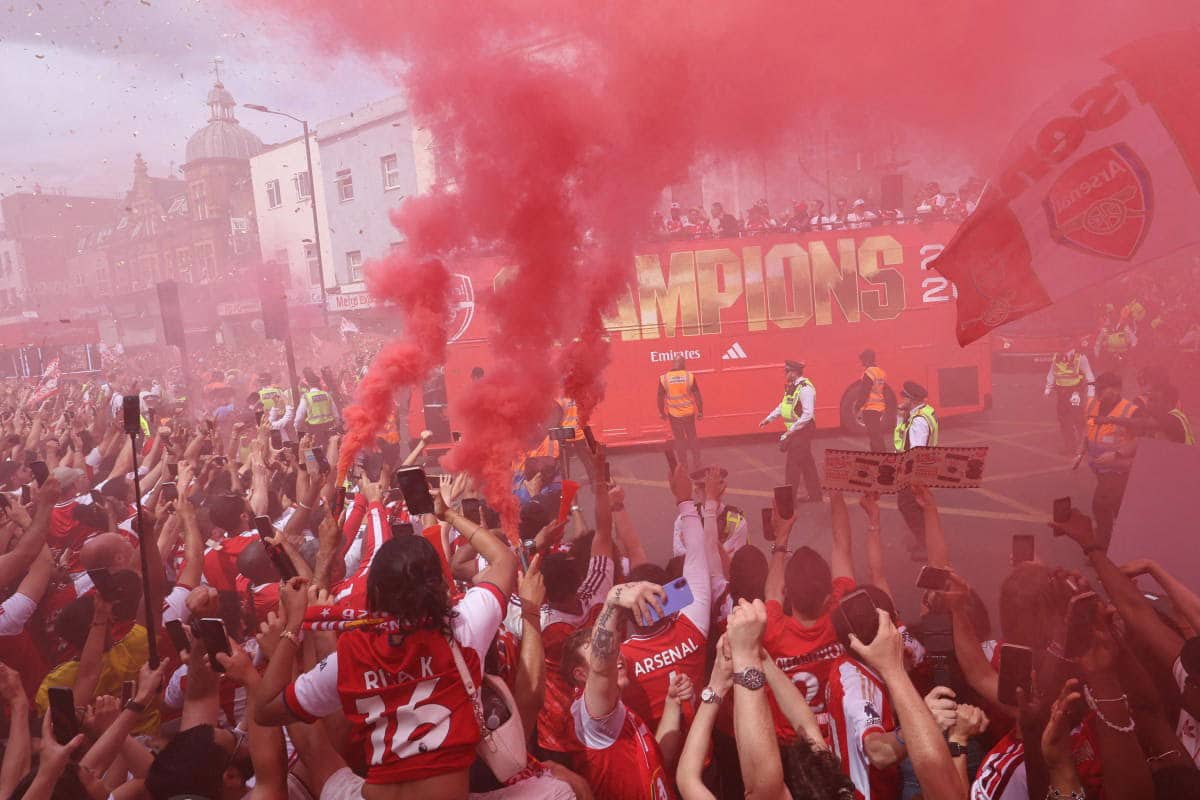 Arsenal fans in a jubilant mood as they celebrate their Premier League title win.