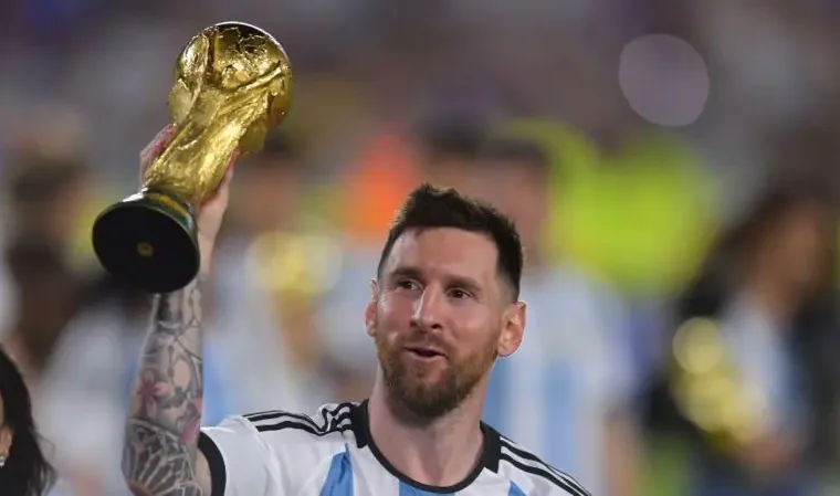 Argentina international, Lionel Messi lifting the 2022 FIFA World Cup.