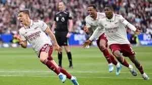 Arsenal players celebrating Trossard late goal to edge West Ham in Premier League match on Sunday, May 10, 2026