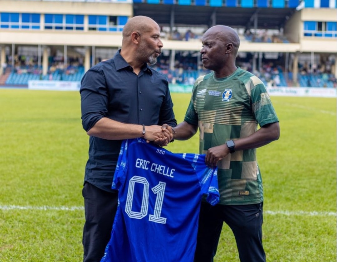 Shooting Stars Coach Nurudeen Aweroro exchanging jersey with Super Eagles coach, Eric Chelle on Sunday, May 3.
