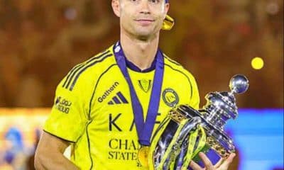 Cristiano Ronaldo poses with the Saudi Pro League title