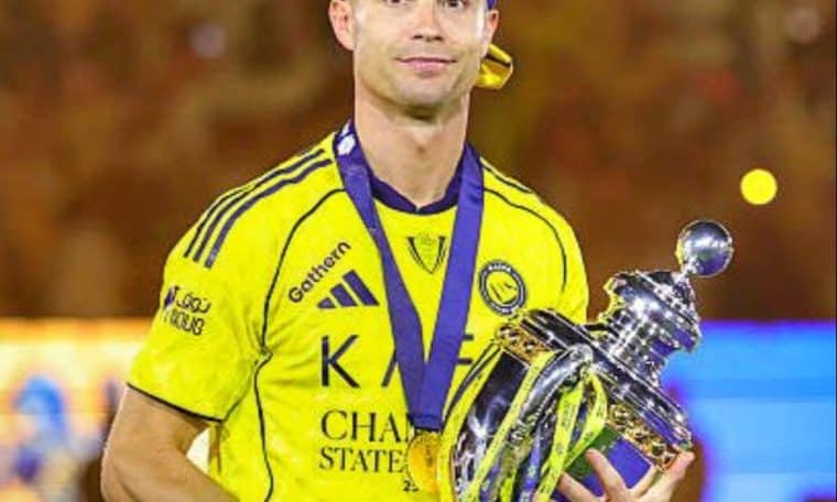 Cristiano Ronaldo poses with the Saudi Pro League title