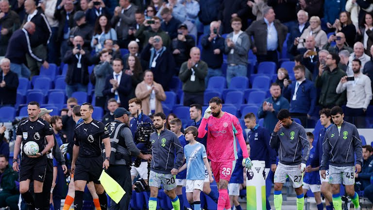 Manchester City players stepping to the pitch to take on Everton on Monday, May 4, 2026.