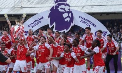 Arsenal players lift the 2025-2026 Premier League title.