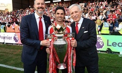 L-R: Josh, Mikel Arteta, and Stan Kroenke posing with the English Premier League title.