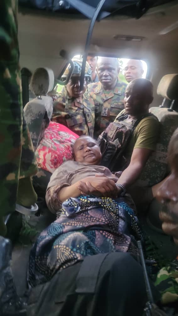 Troops with the rescued Mrs. Abubakar