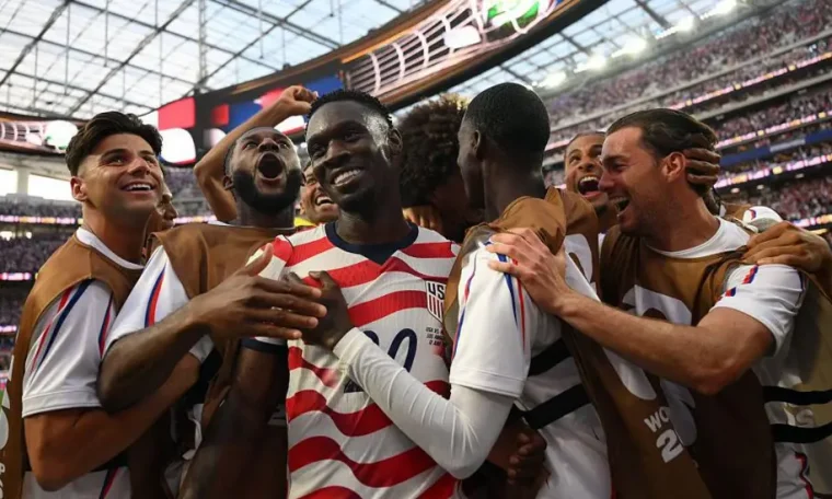 Folarin Balogun celebrate with his teammates after scoring against Paraguay in USA's 2026 FIFA World Cup opener.