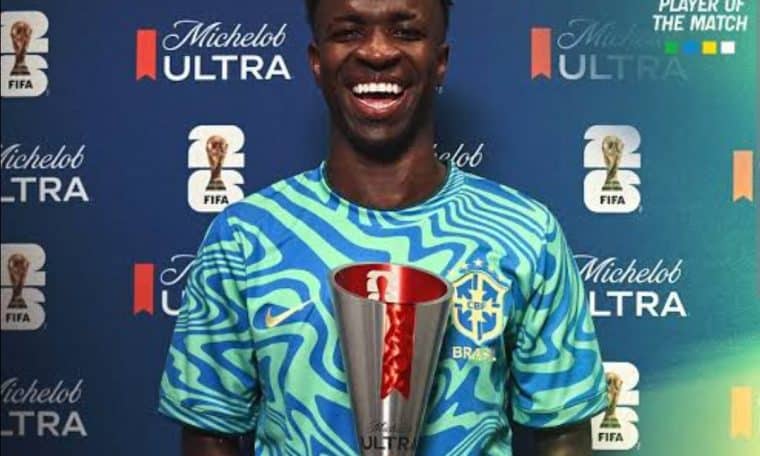 Vinicius Junior posing with the Man of the match award after a 2026 FIFA World Cup match.
