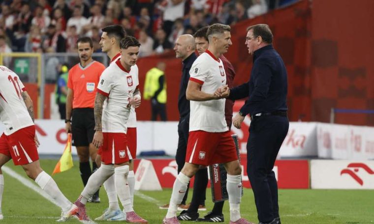 File photo of Poland manager Jan Urban interacting with Polish players.