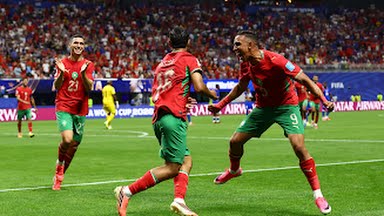 Morocco players celebrate their qualification to the 2026 World Cup round of 32.