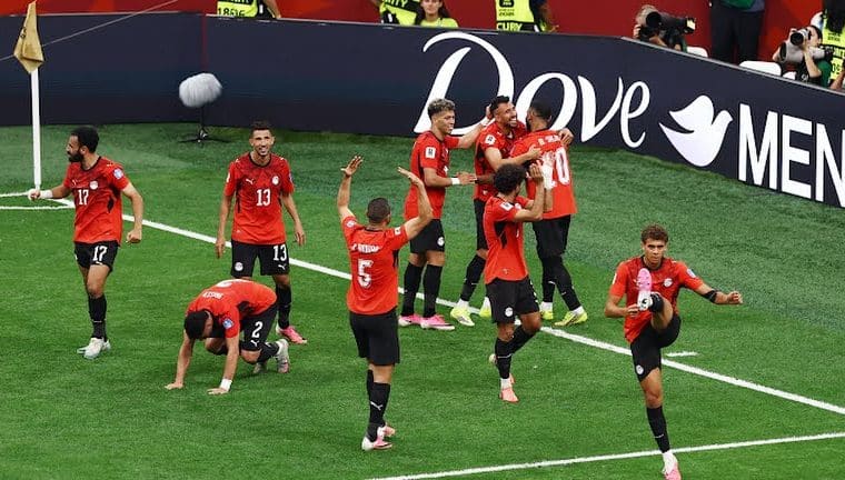 Egyptian players celebrate their first-ever FIFA World Cup win.