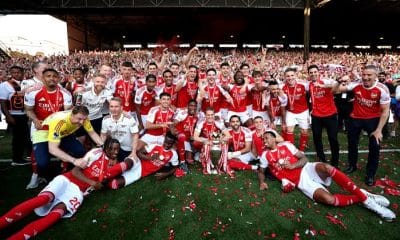 Arsenal players celebrating their 2025-2026 Premier League title win.