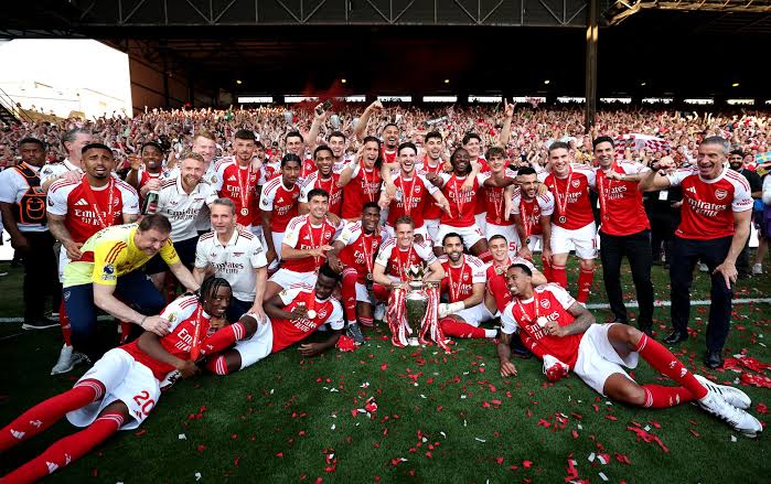 Arsenal players celebrating their 2025-2026 Premier League title win.