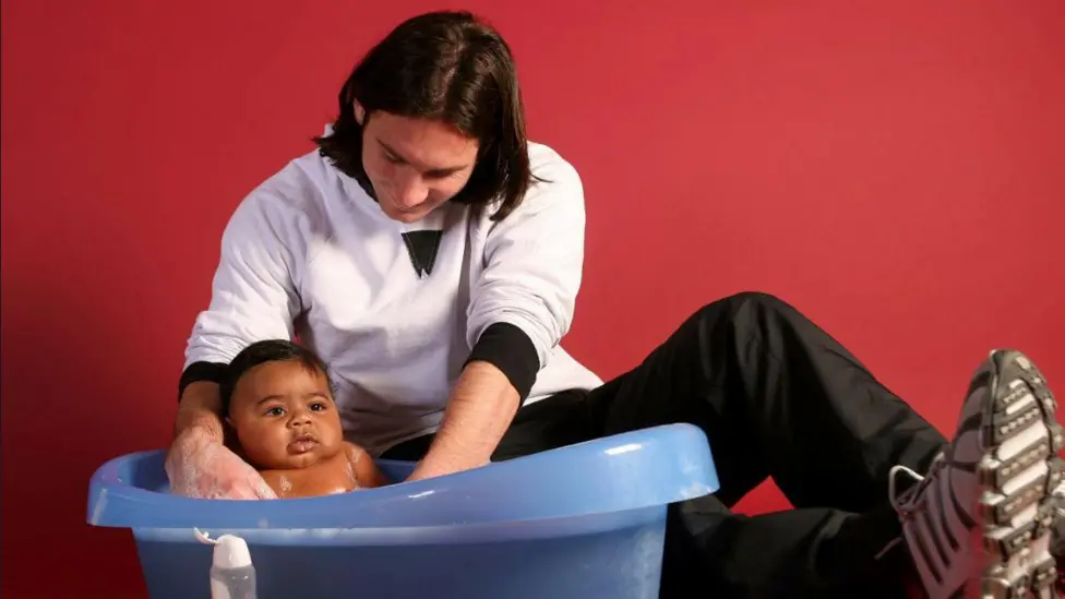File photo of Lionel Messi bathing baby Lamine Yamal.