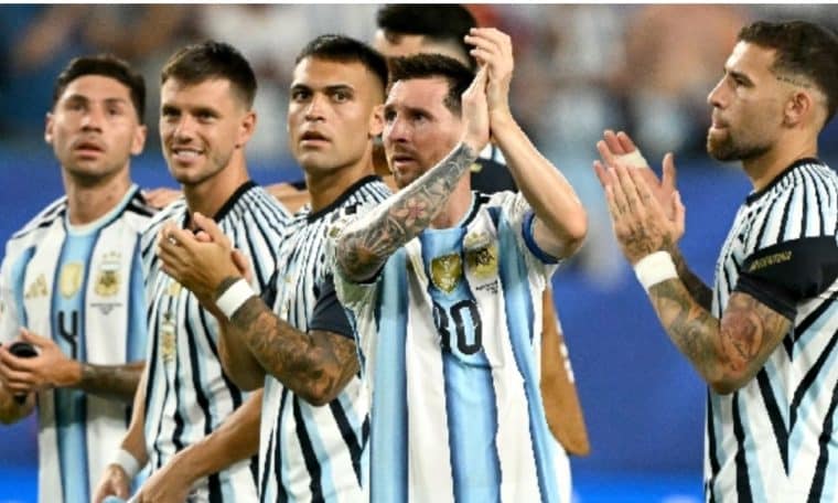 Argentina players celebrating after winning a World Cup match.