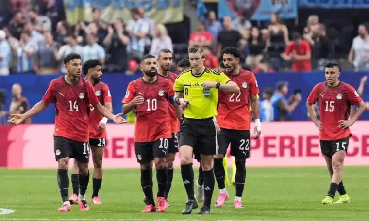 Egyptian players appealing with French referee Francois Letexier for a penalty during their World Cup clash with Argentina.