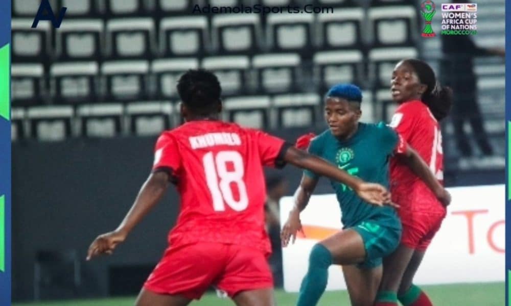 Super Falcons captain, Rasheedat Ajibade in action against Malawi players.