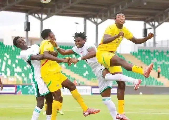 Flying Eagles of Nigeria players in action against Ghana in 2026 WAFU B