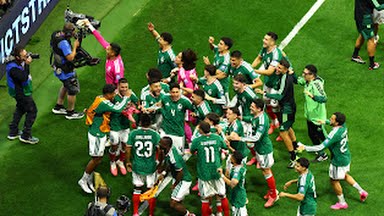 Mexican players celebrate their qualification to the 2026 World Cup round of 16.
