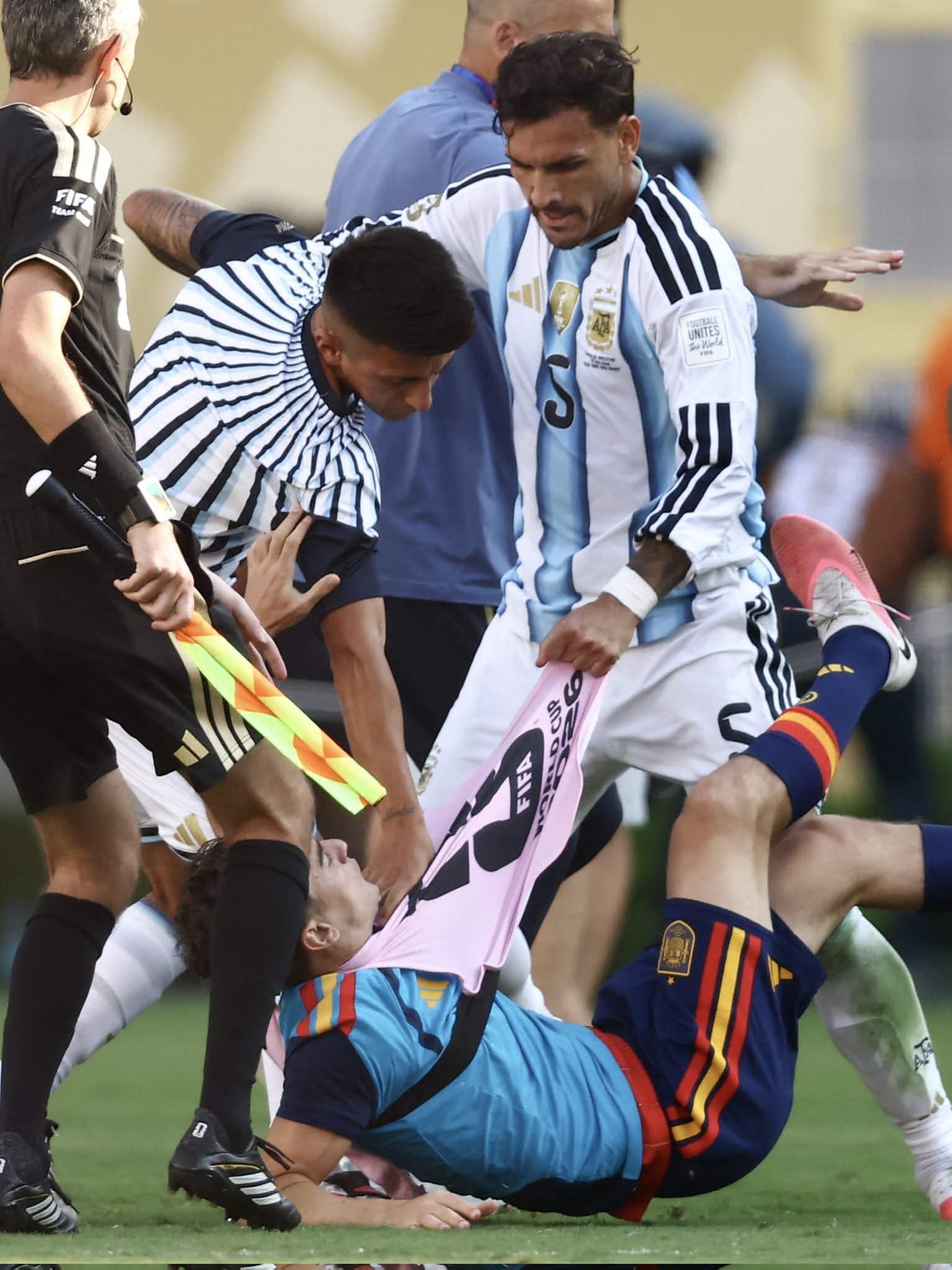 Leandro Paredes battling with a Spanish player after the final whistle of the 2026 FIFA World Cup.
